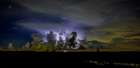 A distant thunder storm and sky draws contrast to the dark Big Cypress prairie. Art Print